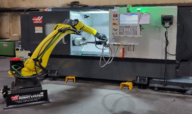 2023 HAAS VF3-YT/50 CNC vertical machining center with a Fanuc M-20iD Material Handling Robot Arm 